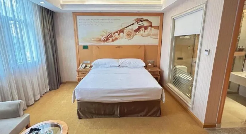 Bed in Vienna Hotel Guangxi Beiliu Passenger Station