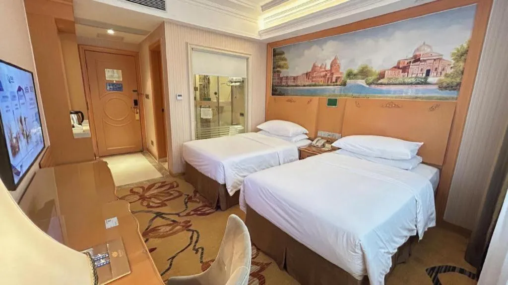 Bed in Vienna Hotel Guangxi Beiliu Passenger Station