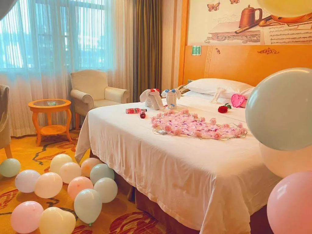 Bed in Vienna Hotel Guangxi Beiliu Passenger Station