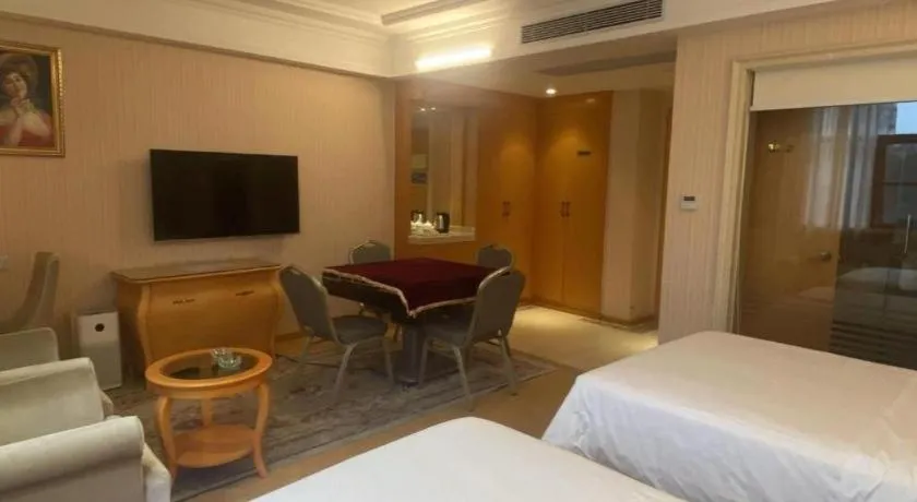 Bed in Vienna Hotel Guangxi Beiliu Passenger Station