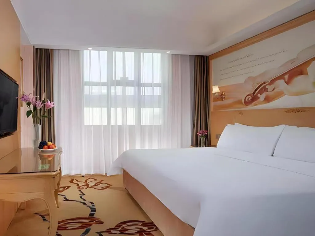 Bed in Vienna Hotel Guangxi Beiliu Passenger Station