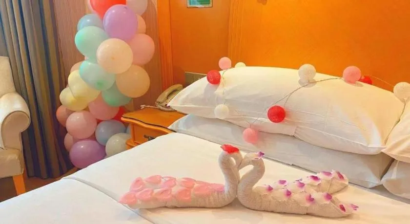 Bed in Vienna Hotel Guangxi Beiliu Passenger Station