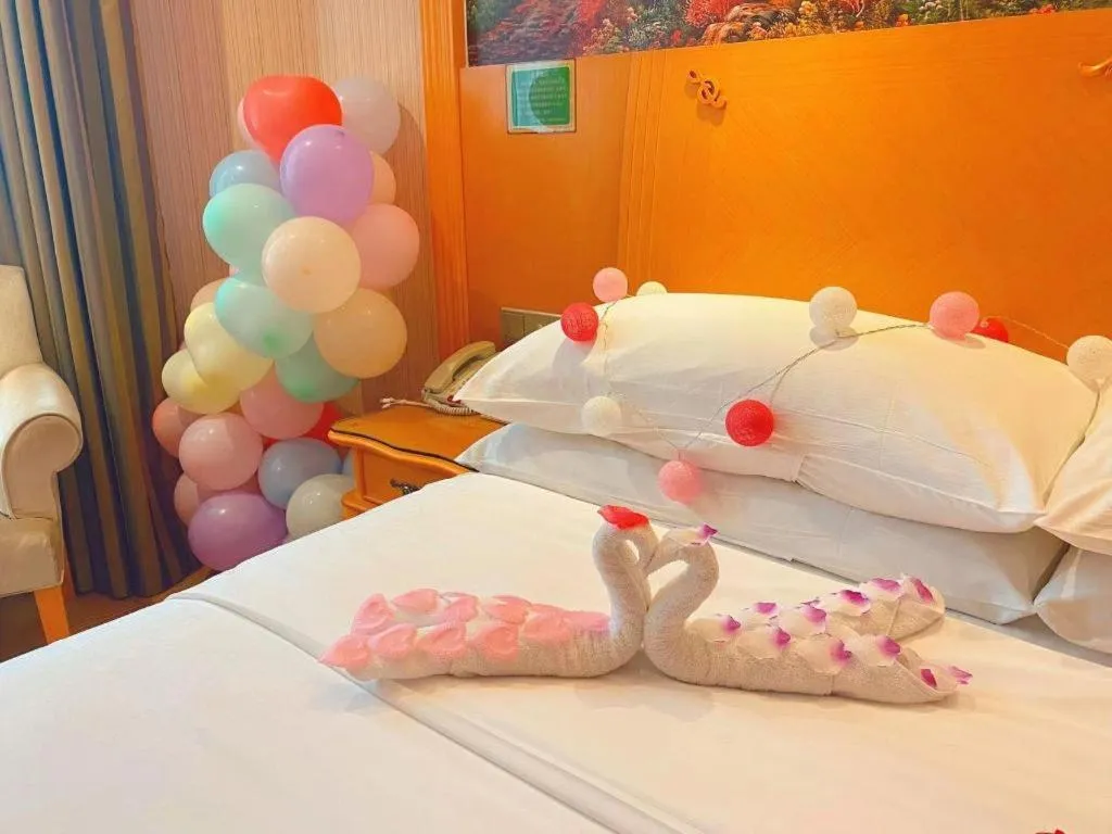 Bed in Vienna Hotel Guangxi Beiliu Passenger Station