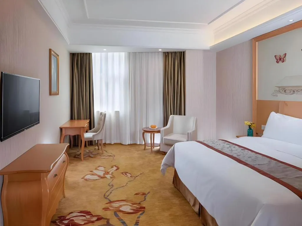 Bed in Vienna Hotel Guangxi Beiliu Passenger Station