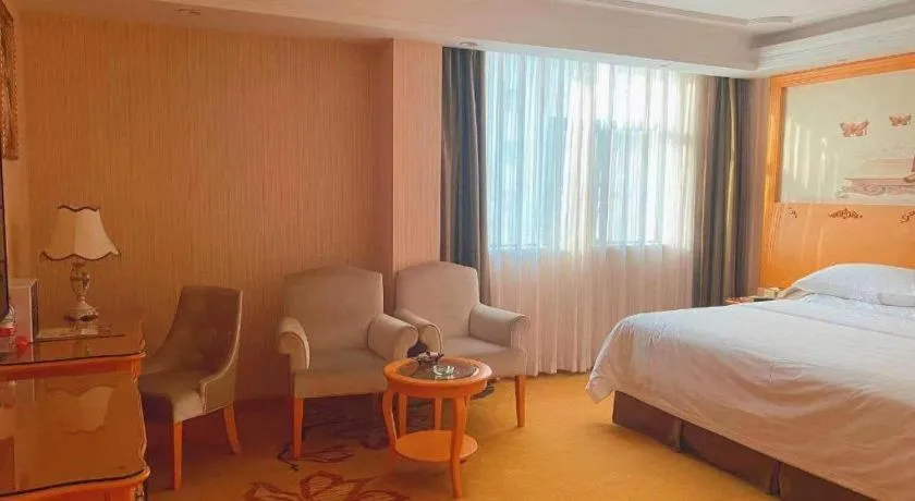 Bed in Vienna Hotel Guangxi Beiliu Passenger Station