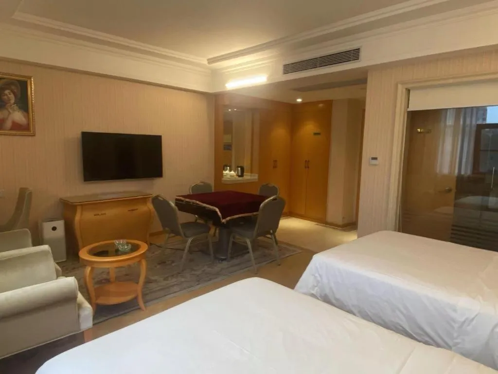 Bed in Vienna Hotel Guangxi Beiliu Passenger Station