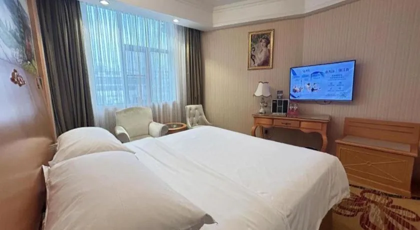 Bed in Vienna Hotel Guangxi Beiliu Passenger Station