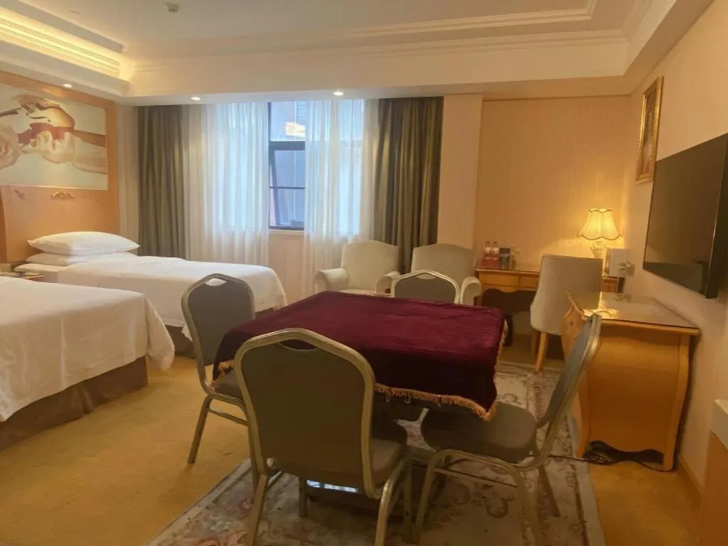 Bed in Vienna Hotel Guangxi Beiliu Passenger Station