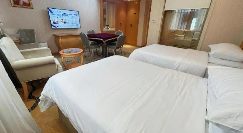 Bed in Vienna Hotel Guangxi Beiliu Passenger Station