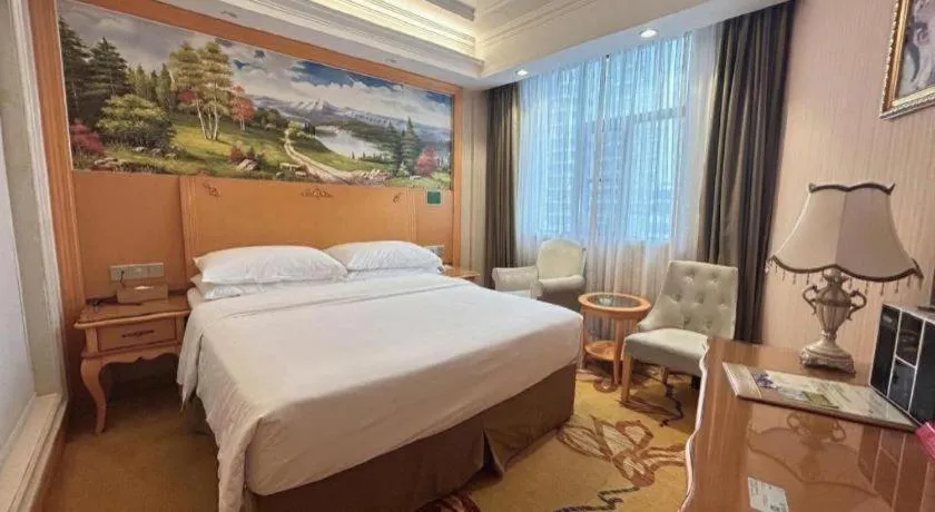 Bed in Vienna Hotel Guangxi Beiliu Passenger Station