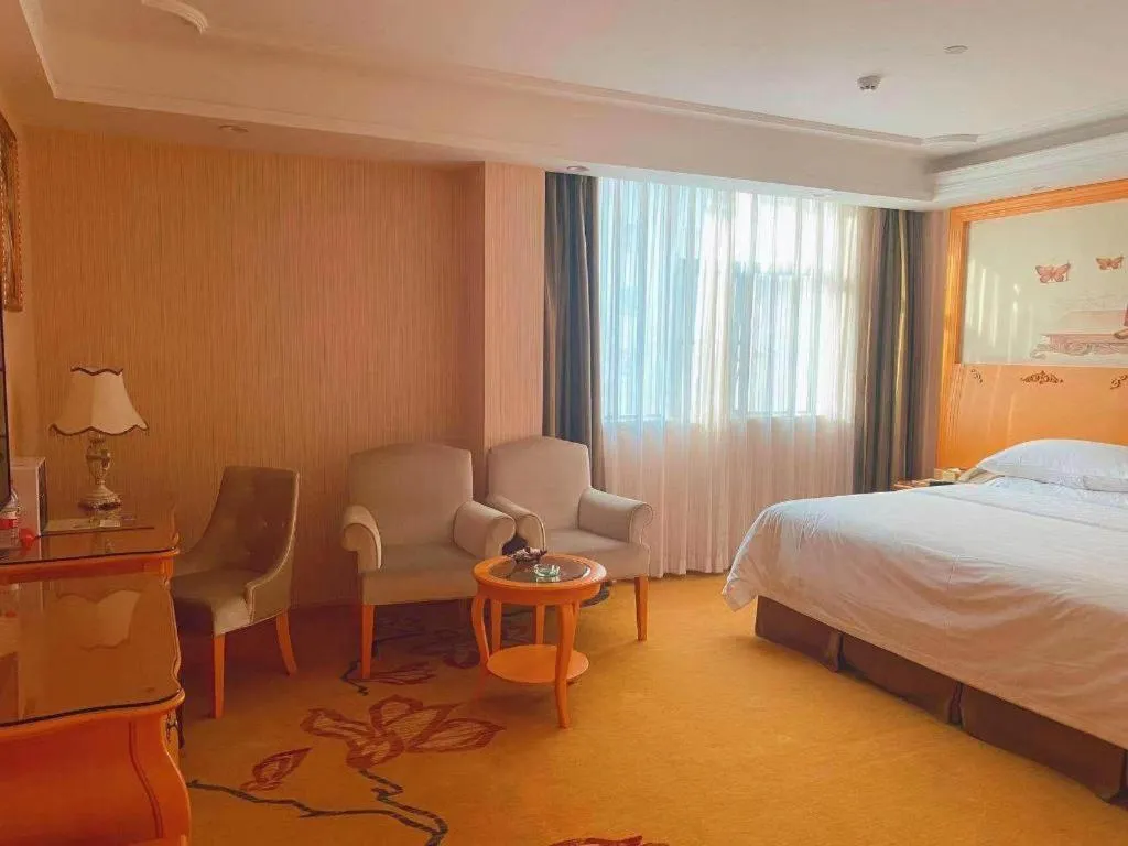 Bed in Vienna Hotel Guangxi Beiliu Passenger Station