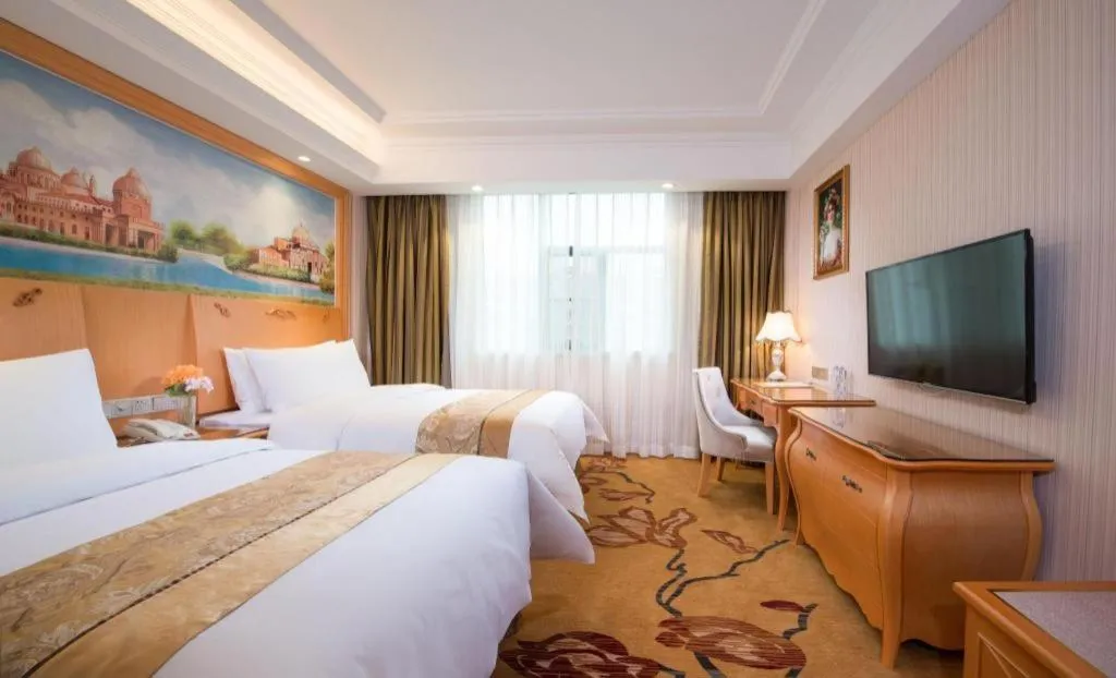 Bed in Vienna Hotel Guangxi Beiliu Passenger Station