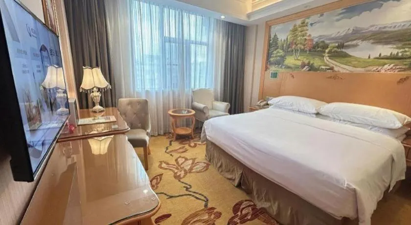 Bed in Vienna Hotel Guangxi Beiliu Passenger Station