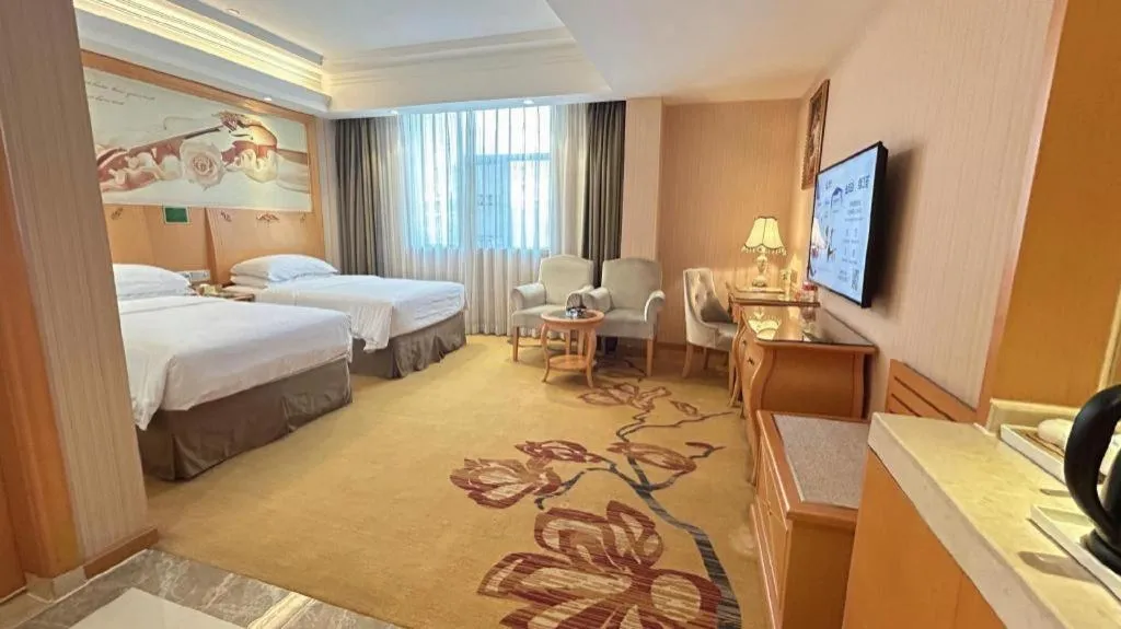 Bed in Vienna Hotel Guangxi Beiliu Passenger Station