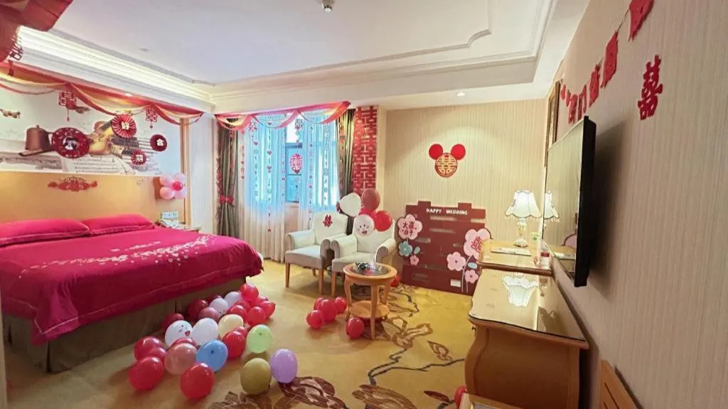 Bed in Vienna Hotel Guangxi Beiliu Passenger Station