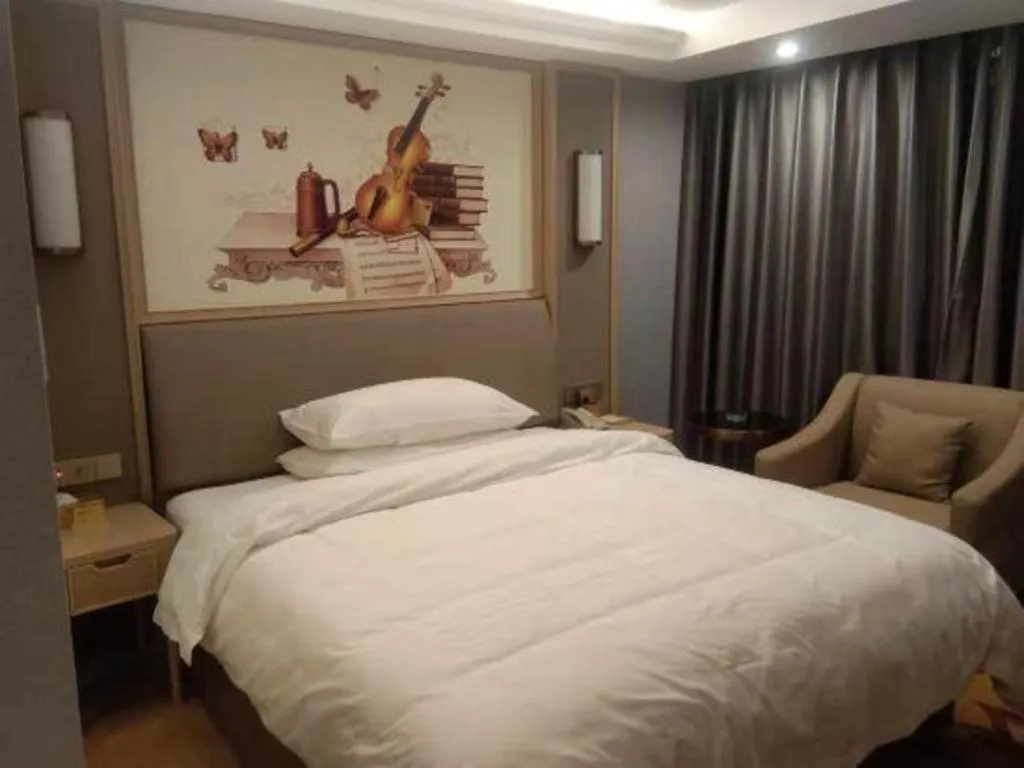 Bed in Vienna Hotel Zhejiang Lishui Qingtian Post Building