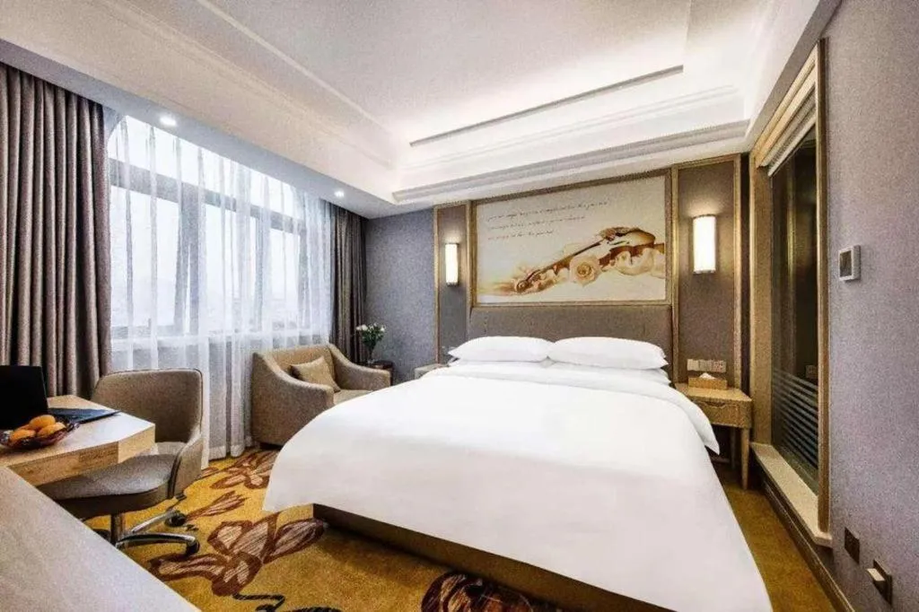 Bed in Vienna Hotel Zhejiang Lishui Qingtian Post Building