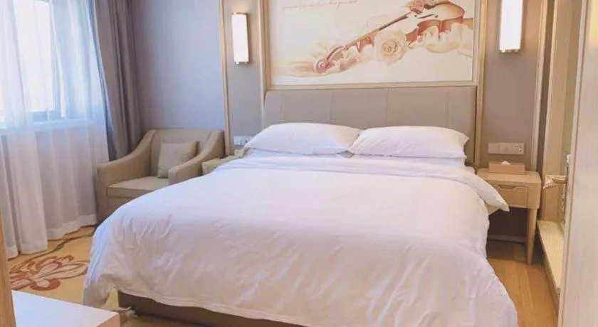 Bed in Vienna Hotel Zhejiang Lishui Qingtian Post Building
