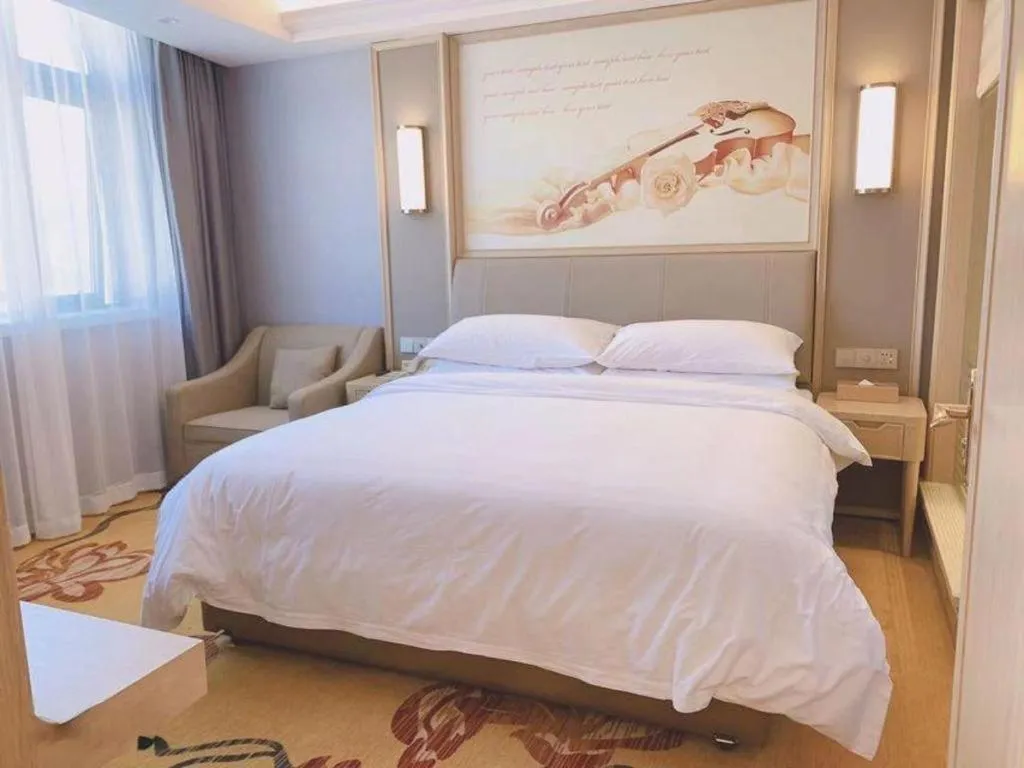 Bed in Vienna Hotel Zhejiang Lishui Qingtian Post Building