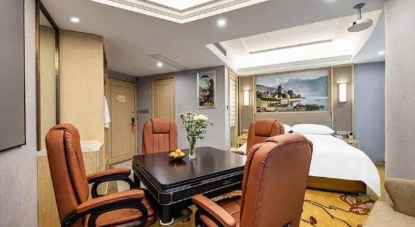 Bed in Vienna Hotel Zhejiang Lishui Qingtian Post Building