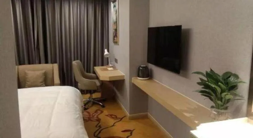 Bed in Vienna Hotel Zhejiang Lishui Qingtian Post Building