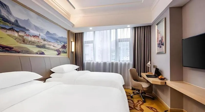 Bed in Vienna Hotel Zhejiang Lishui Qingtian Post Building