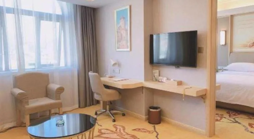 Bed in Vienna Hotel Zhejiang Lishui Qingtian Post Building