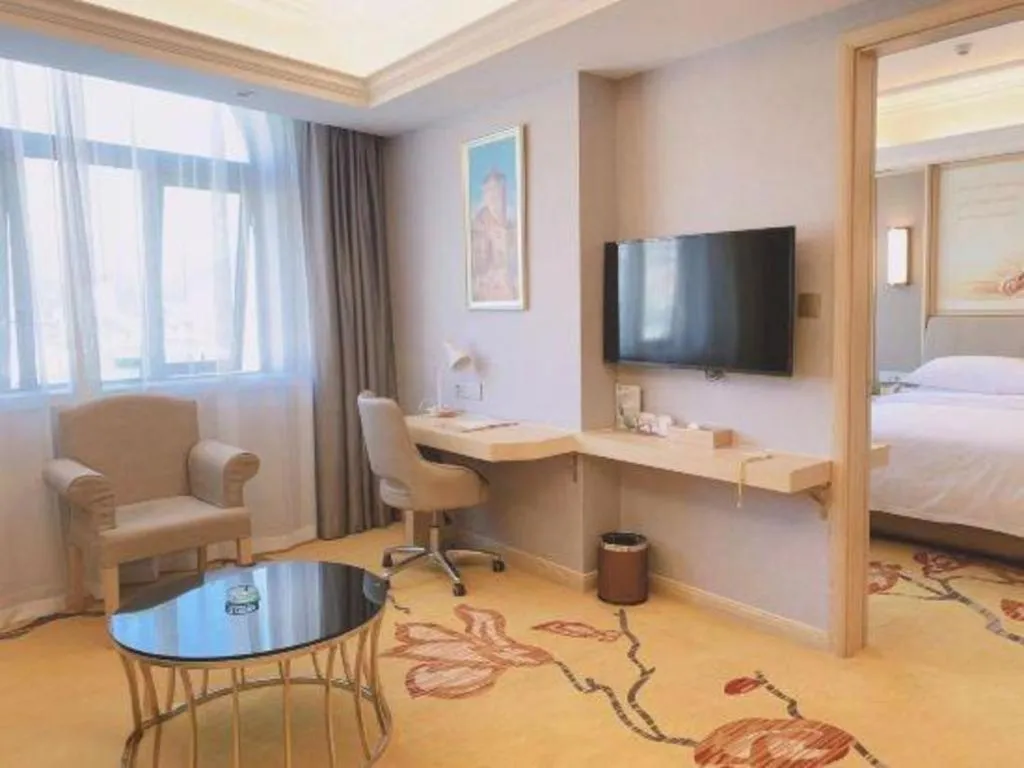 Bed in Vienna Hotel Zhejiang Lishui Qingtian Post Building