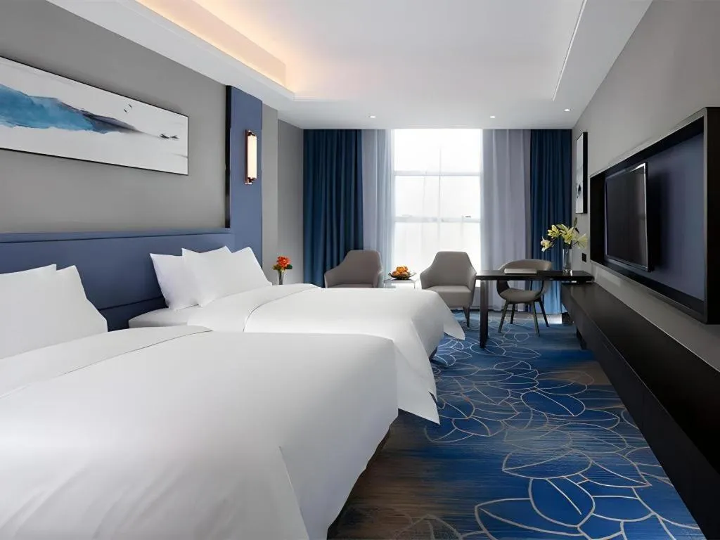 Bed in Vienna Hotel Guangdong Foshan Yihuanlishui