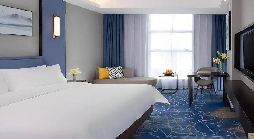 Bed in Vienna Hotel Guangdong Foshan Yihuanlishui