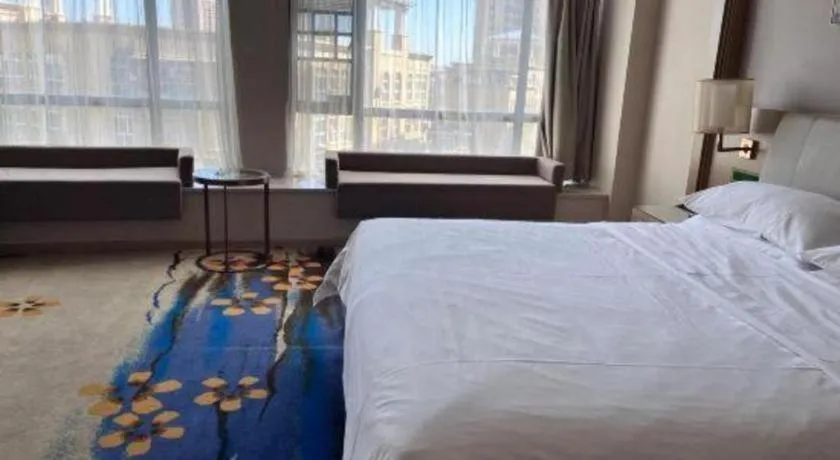 Bed in Vienna Hotel Xinfeng West High-Speed Railway Station