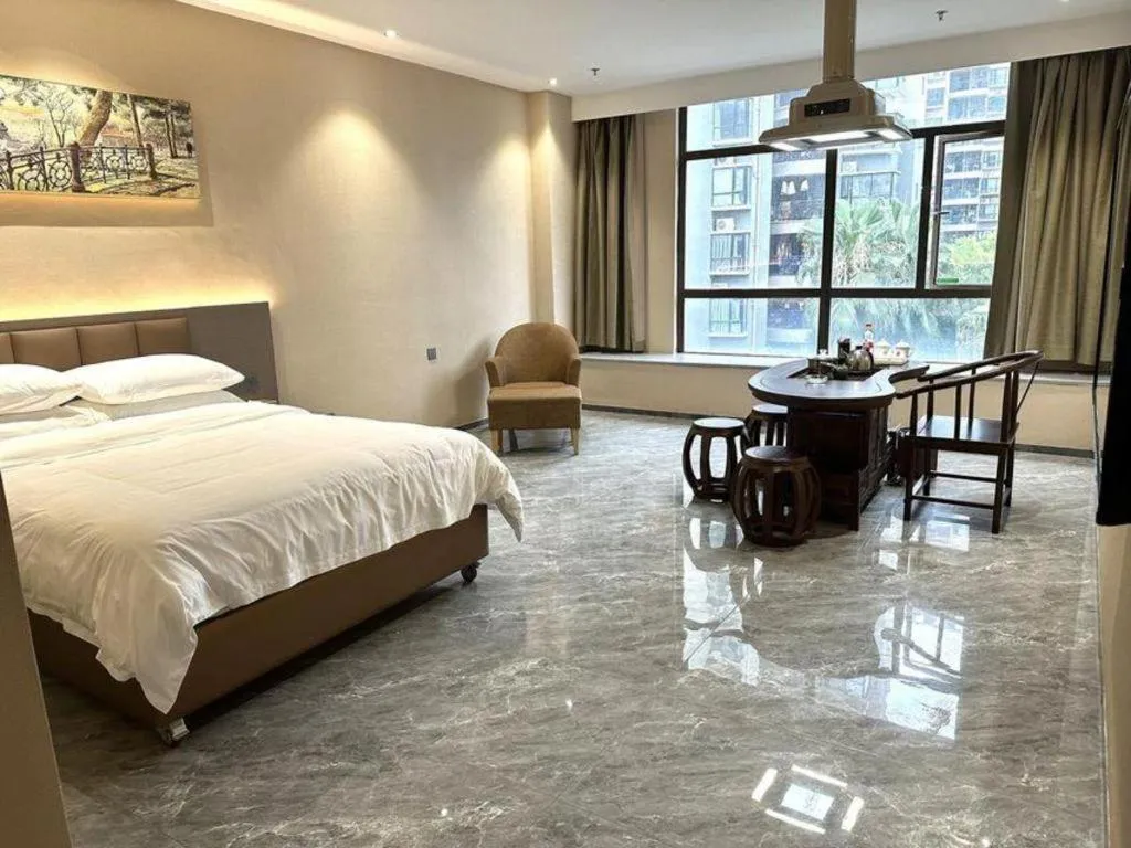 Bed in Vienna Hotel Xinfeng West High-Speed Railway Station