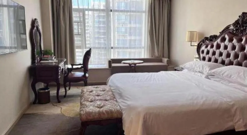 Bed in Vienna Hotel Xinfeng West High-Speed Railway Station