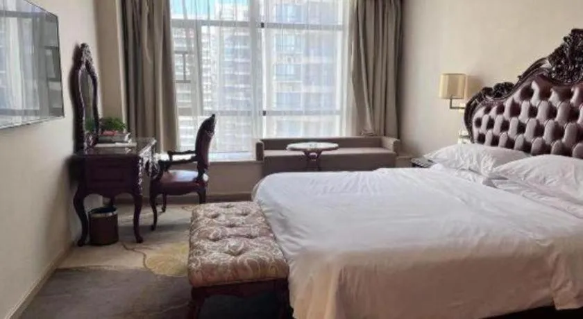 Bed in Vienna Hotel Xinfeng West High-Speed Railway Station