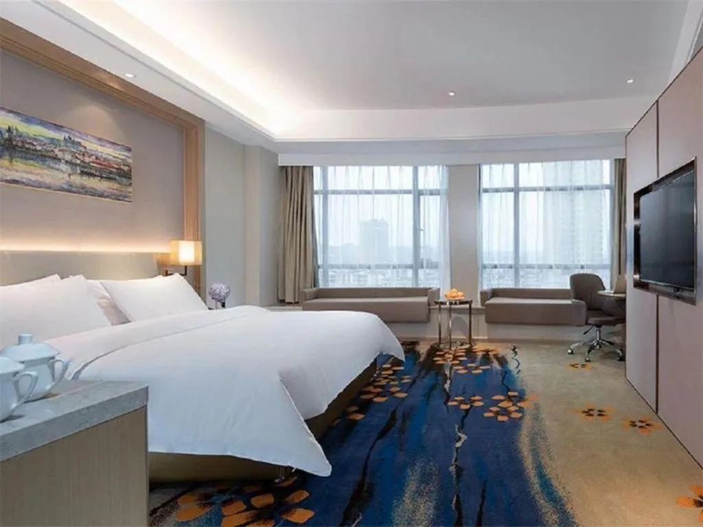 Bed in Vienna Hotel Xinfeng West High-Speed Railway Station