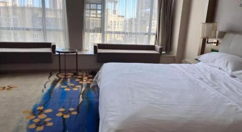 Bed in Vienna Hotel Xinfeng West High-Speed Railway Station