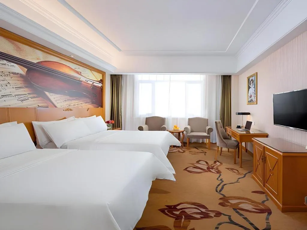 Bed in Vienna Hotel Shanxi Datong High-Speed Railway Station Wanda Plaza
