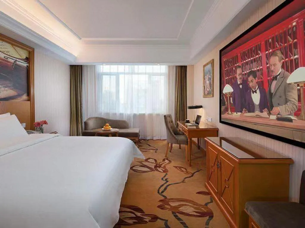 Bed in Vienna Hotel Shanxi Datong High-Speed Railway Station Wanda Plaza