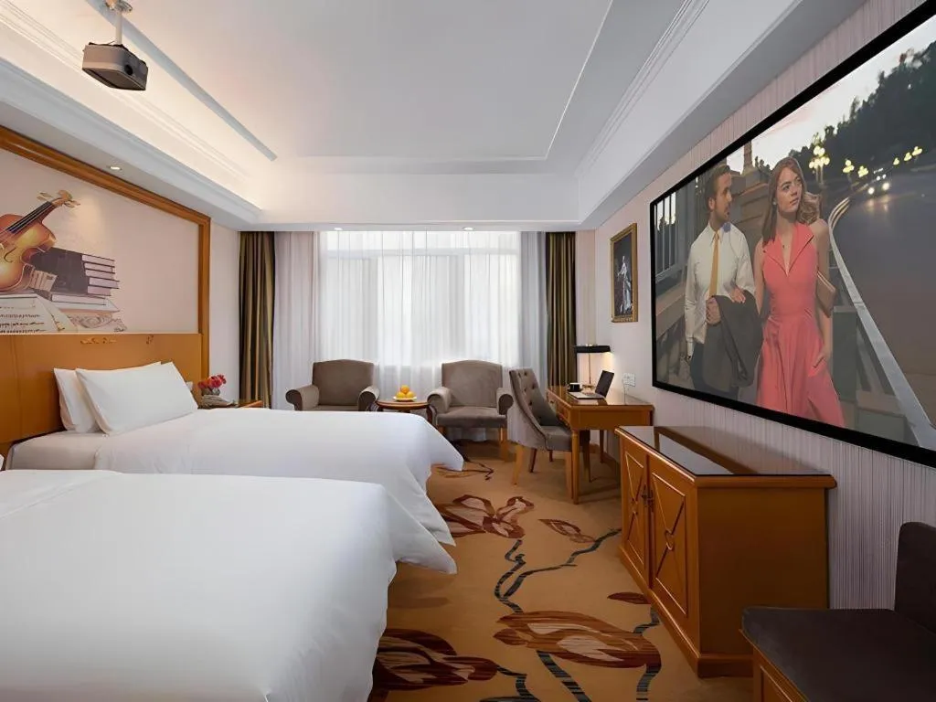 Bed in Vienna Hotel Shanxi Datong High-Speed Railway Station Wanda Plaza