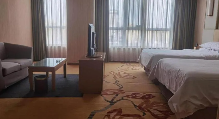 Bed in Vienna Hotel Shandong Qingzhou Ancient City