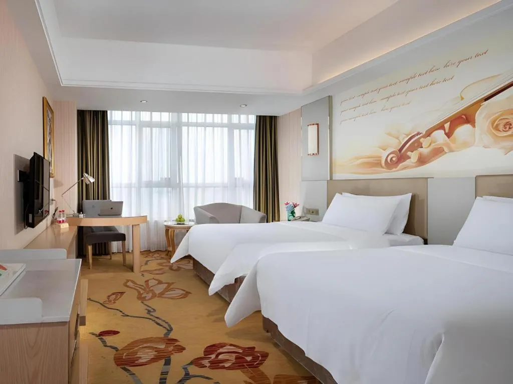 Bed in Vienna Hotel Shandong Qingzhou Ancient City