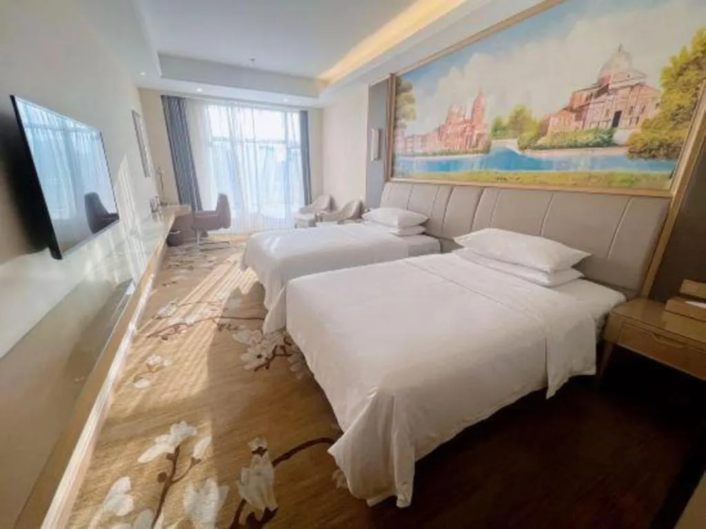 Bed in Vienna Hotel Tianjin Binhai International Airport Free Trade Zone