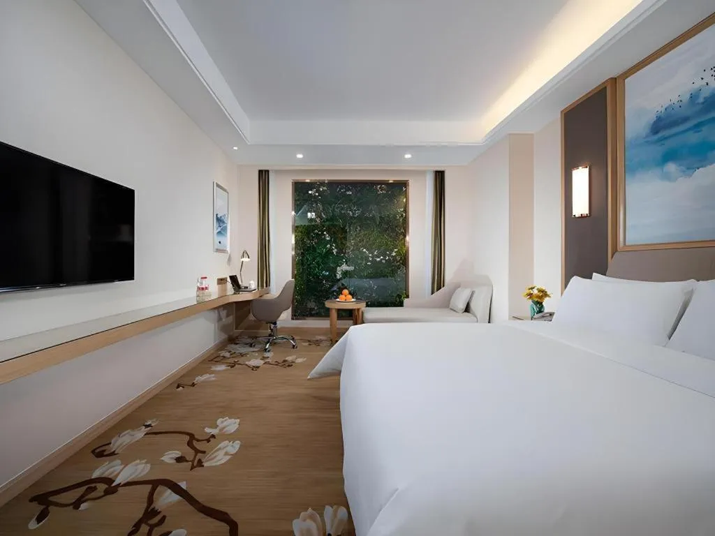 Bed in Vienna Hotel Tianjin Binhai International Airport Free Trade Zone