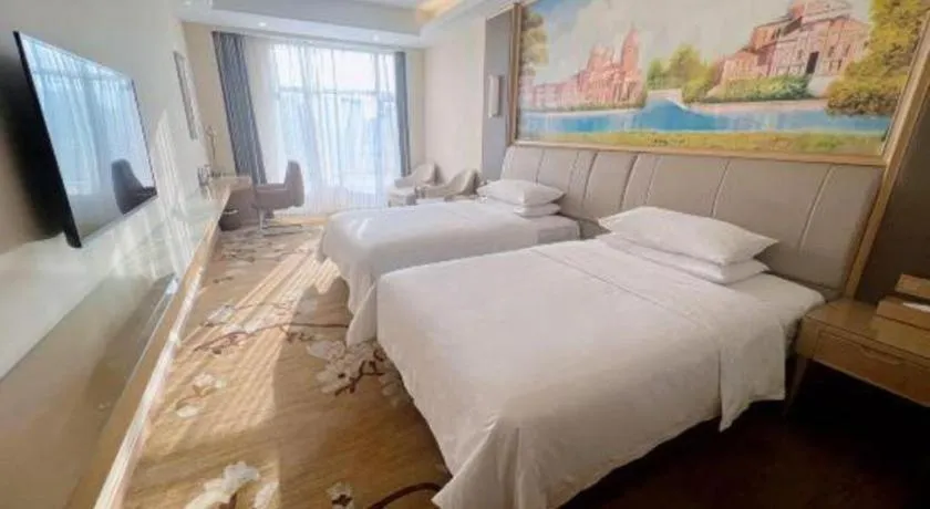 Bed in Vienna Hotel Tianjin Binhai International Airport Free Trade Zone