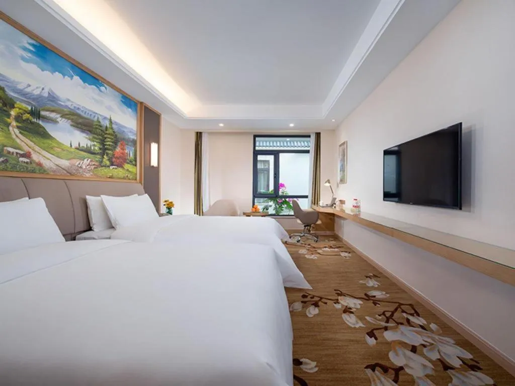 Bed in Vienna Hotel Tianjin Binhai International Airport Free Trade Zone