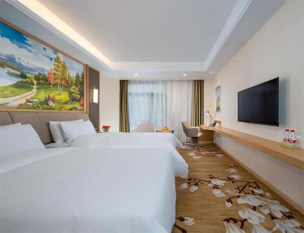 Bed in Vienna Hotel Tianjin Binhai International Airport Free Trade Zone