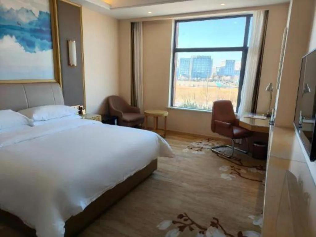 Bed in Vienna Hotel Tianjin Binhai International Airport Free Trade Zone