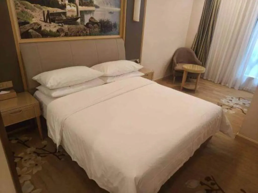 Bed in Vienna Hotel Tianjin Binhai International Airport Free Trade Zone
