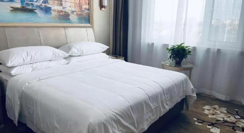 Bed in Vienna Hotel Shandong Qingdao Jiaodong International Airport Hai'er Avenue