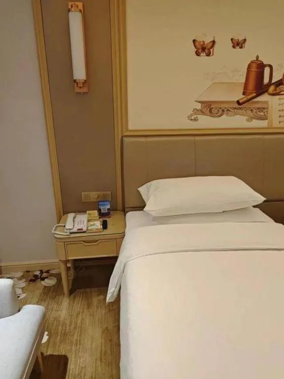 Bed in Vienna Hotel Shandong Qingdao Jiaodong International Airport Hai'er Avenue